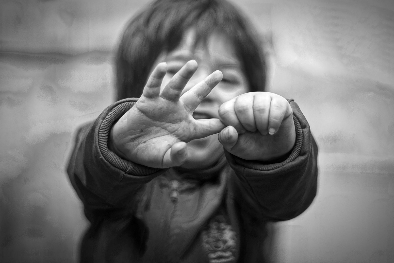 Child with hands raised